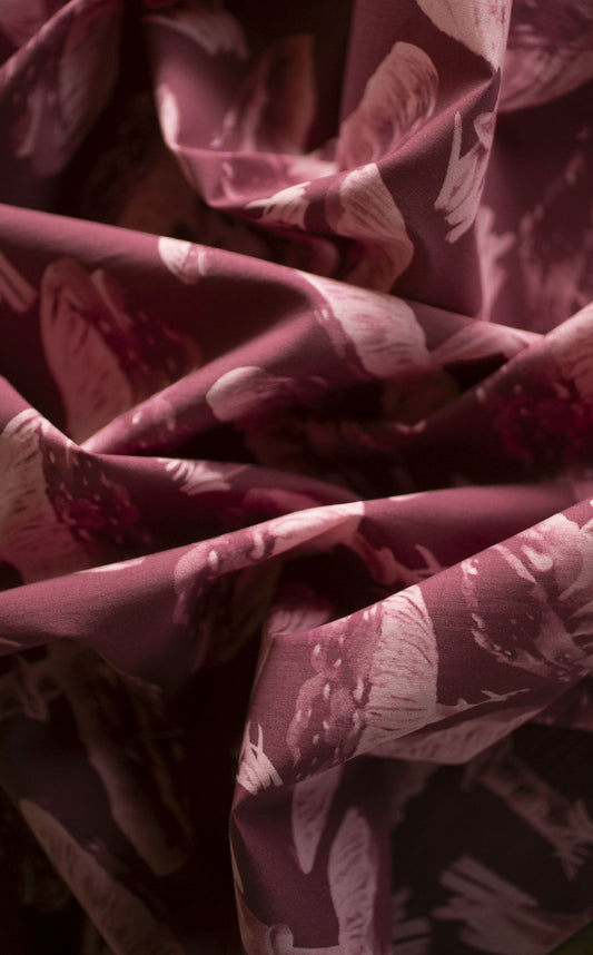 Close-up of LIBE printed silk, folded to catch the light